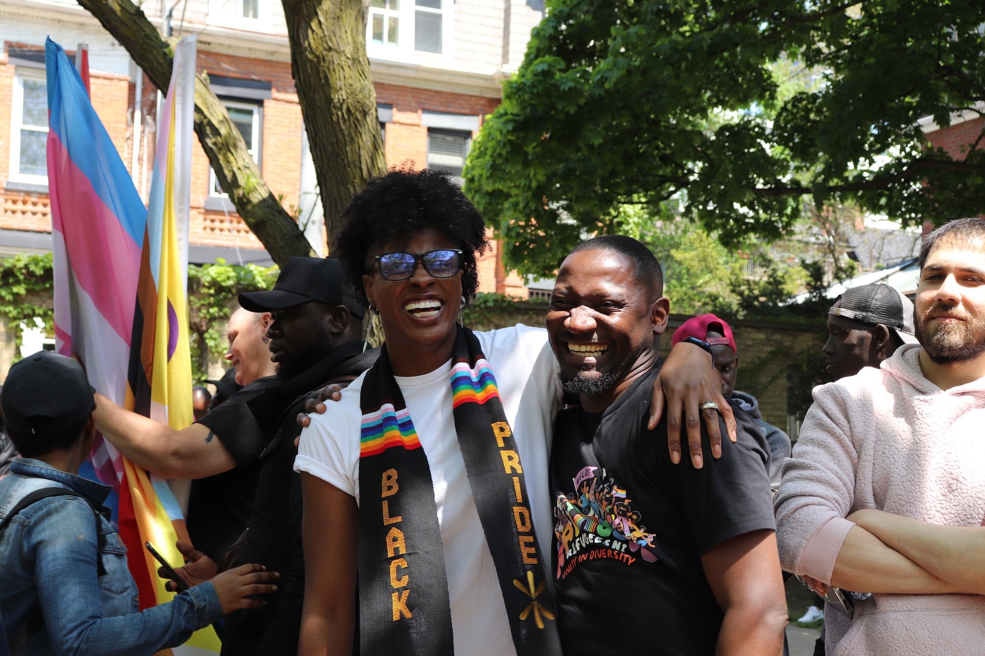 Two adults smiling and embracing each other